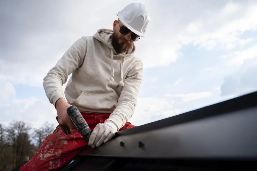 man installing new roof